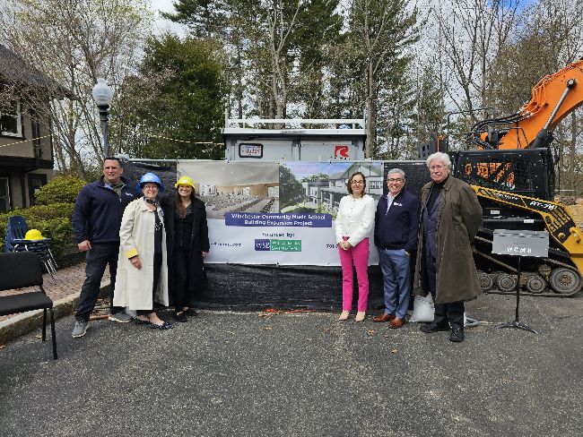 Winchester Savings Bank and Winchester Middle School staff smiling together in community partnership.