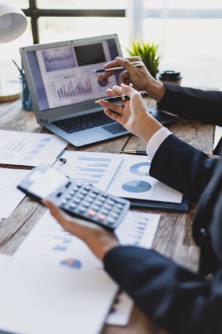 Person using calculator for finances