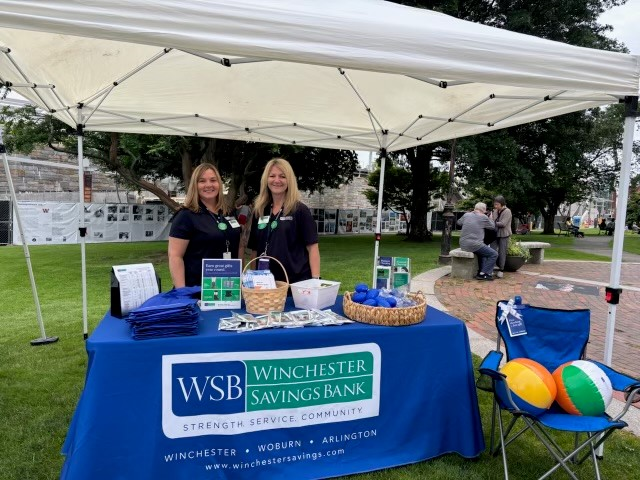 WSB Employees running a booth at the farmers market